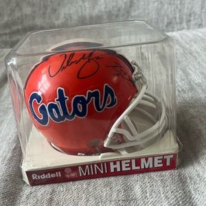Gators mini helmet signed by Urban Meyer + Tim Tebow